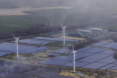 Aerial view of wind turbines and solar installations, taken near Wischhafen, 25/03/2024