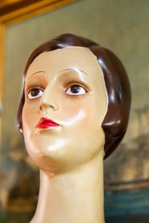 Female mannequin head close up 1920s haircut style, inside antiques centre, Marlesford Mill,