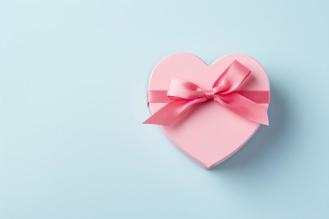 Single pink heart shaped gift box on pastel pink background. KI generiert, generiert, AI generated