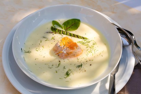 Southern German cuisine, sorrel soup with char, freshwater fish, soup arranged in a plate, herbs,