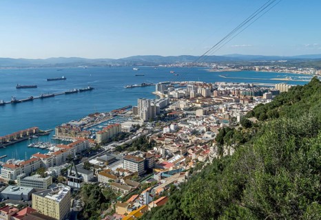 View of the city of Gibraltar and cable car near the top of the Rock of Gibraltar