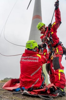 Height rescuers from the Oberhausen professional fire brigade practise abseiling from a wind