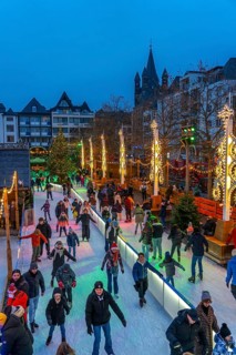 Ice rink at the Christmas market on the Heumarkt in the old town of Cologne, Sunday shopping in
