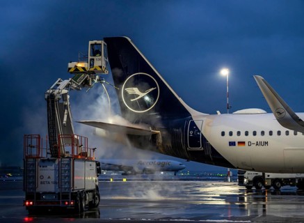 Winter at Frankfurt Main Airport, FRA, Lufthansa aircraft being de-iced by de-icing vehicles,