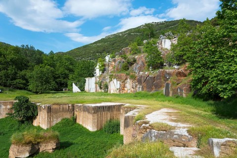 Quarry surrounded by lush greenery and clear skies, Kavala, Dímos Kaválas, Eastern Macedonia and