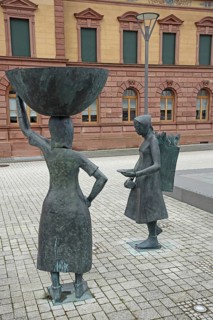 Sculpture shoe carrier and monument to former shoe industry, shoe production, shoe carrier,