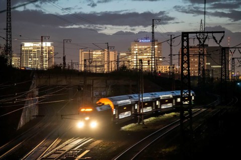 Skyline of Essen city centre, railway facilities in front of the main station, regional train,