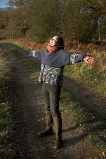 Model released woman enjoying winter sun in the countryside