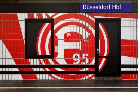 Large logo in club colours of Fortuna Düsseldorf on a wall with tiles, Düsseldorf Central Station,