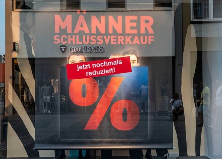 Sale, shop window with advertisement for discounts, percentages, clothing, men's sale, reduced,
