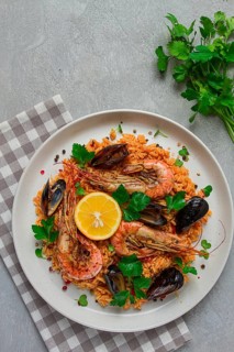 Seafood paella, shrimp and mussels risotto, rice, homemade, top view, no people