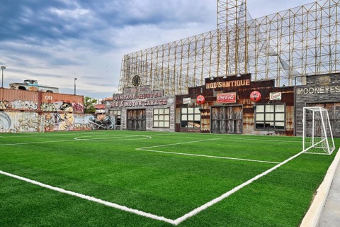 Football pitch surrounded by iconic scenery, Bangkok, Thailand, Asia