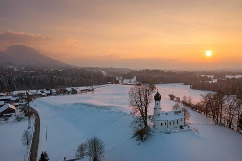 Sunset, Church of the Visitation of the Virgin Mary in winter, Oberbuchen, drone shot, Tölzer Land,