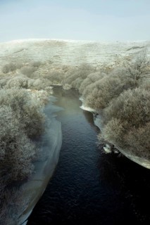 Aubrac plateau. Frozen river Bès. Lozere department. Occitanie. France