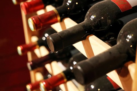Wine cellar with red wine bottles