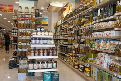 View into a grocery shop with well-stocked shelves full of products, Ouranoupoli, City of Heaven,