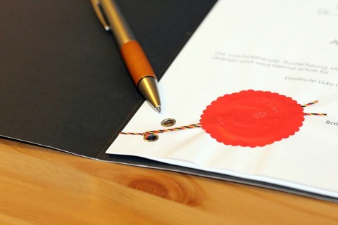 Notarised contract with red official seal