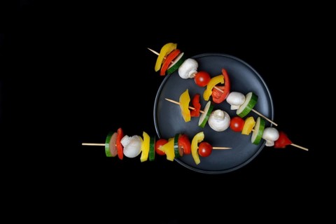 Colourful vegetable skewers on a plate, barbecue skewers