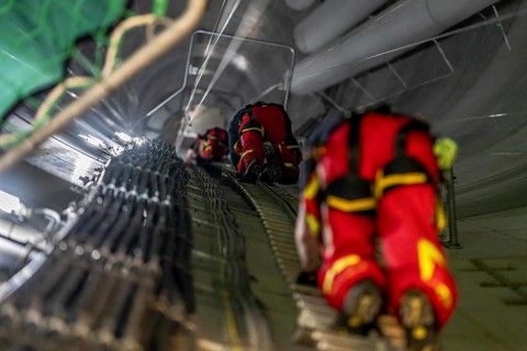Height rescuers from the Oberhausen professional fire brigade practise abseiling from a wind