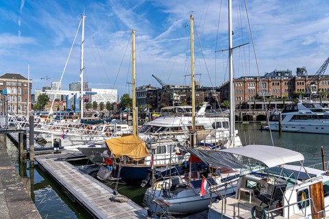 Rotterdam Marina, behind high-rise buildings in the Maritiem District on the other side of the