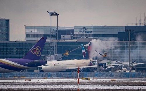 Winter at Frankfurt Main Airport, FRA, Delta aircraft being de-iced at the terminal, Hesse,