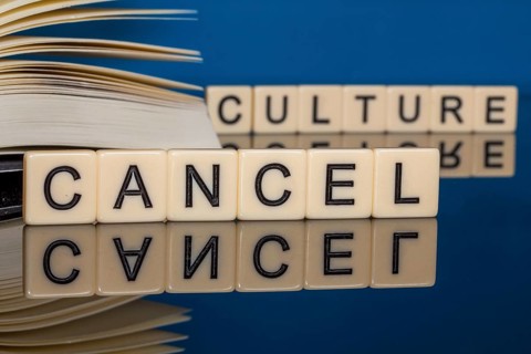 Symbolic image Cancel Culture: Letter cubes show the words Cancel Culture in front of a book
