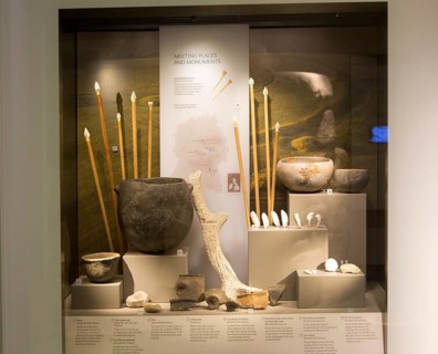 Display of objects found deposited at Neolithic meeting places and monuments in Wiltshire. With