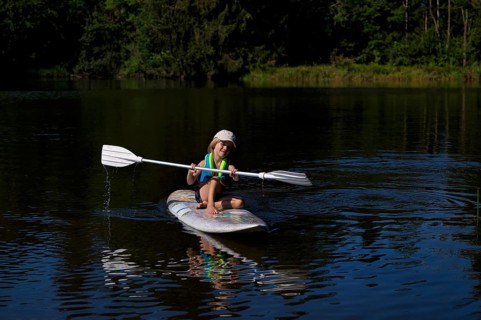 Little boy, 4 years old, paddling on surfboard, surfboard, lake, Schwaltenweiher, honey village