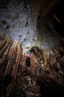 Woman exploring stalactite cave, Terciopelo Cave, Barra Honda National Park, Costa Rica, Central