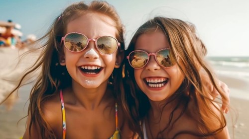 Two young girlfriends posing wearing sunglasses having fun on the beach, generatvie AI, AI
