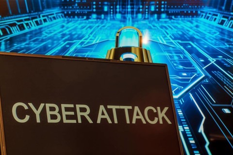 Cyber attack symbol: Laptop in front of a virtual computer background