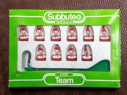 Boxed set of Subbuteo table soccer team C100 players close up, UK