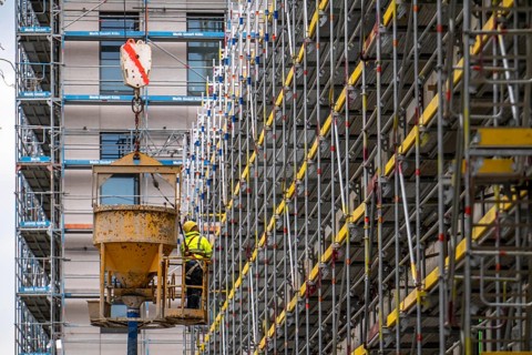 Concreting work on a construction site, new construction of a high-rise office building, facade of