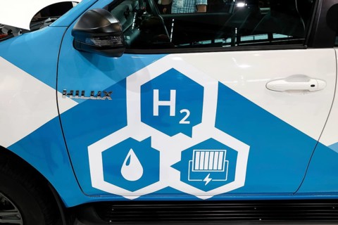 H2 hydrogen fuel cell logo on a Toyoa Hilux Fuel Cell Electric Vehicle at the IAA Transportation