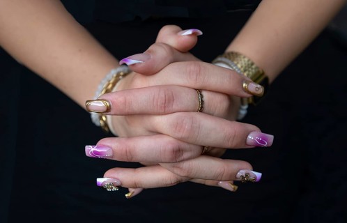 Colourful fingernails of a young woman, on a black background, Baden-Württemberg, Germany, Europe