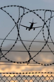 Symbolic image security, passenger aircraft taking off, security fence, Stuttgart Airport,
