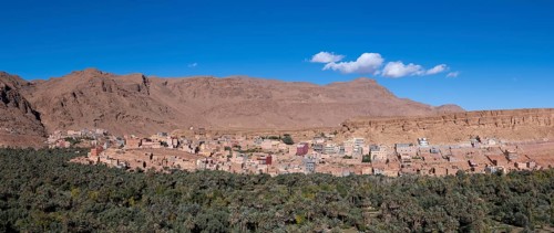 Oasis with traditional mud houses and date palms, on the edge of the Todra Gorge or Gorges du
