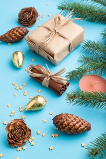 Christmas or New Year composition. Decorations, box, cinnamon, cones, fir and spruce branches, on a