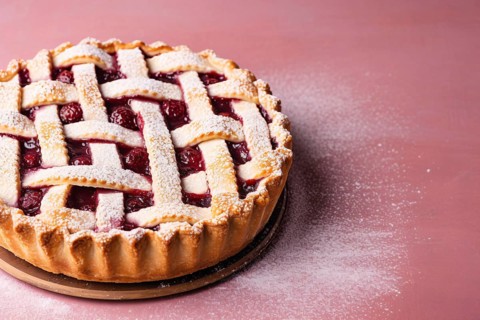Linzertorte tart on pink background. KI generiert, generiert AI generated