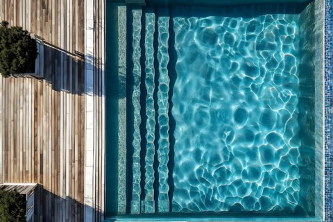 AI generated aerial view perpendicular top down of an wooden deck with a swimming pool at daylight