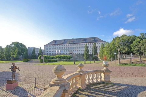 Baroque Friedenstein Palace with sculpture of Duchess Luise Dorothea by Bernd Göbel 2017, shadow,