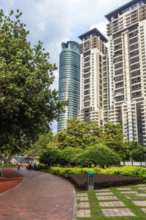 Modern building with a small garden and a brick walkway in Kuala Lumpur, Malaysia, Asia