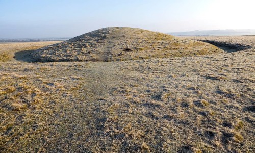 Bronze Age bowl barrow on Windmill Hill, a Neolithic causewayed enclosure, near Avebury, Wiltshire,
