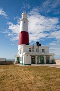 Red and white lighthouse on the coast at Portland Bill, Isle of Portland, Dorset, England, UK