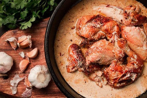 Shkmeruli, fried chicken, in milk-garlic sauce, Georgian cuisine, homemade, close-up, no people