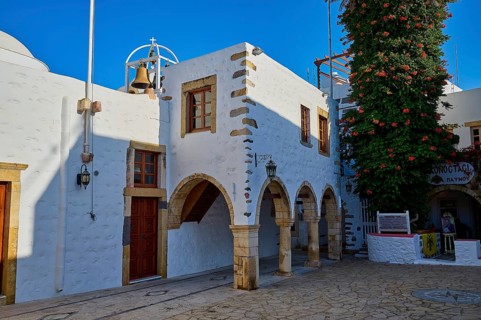 Agios Ioannis Prodromos Church, A whitewashed, historic church building with bell on a Greek