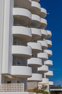 Modern holiday flats with round balconies at the harbour of Santa Eularia, Ibiza, Balearic Islands,