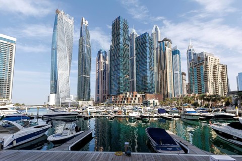 Dubai Marina skyline skyscrapers with yachts property skyscrapers living on the waterfront in