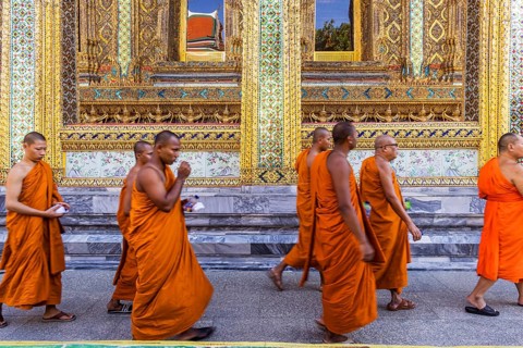 Wat Phra Kaeo temple, royal palace. Royal chapel with Buddhist monks and novices. Bangkok,
