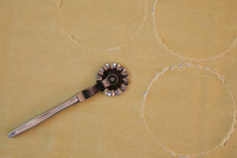 Swabian cuisine, preparation of salmon ravioli, cutting raw pasta dough with a pastry wheel, salmon